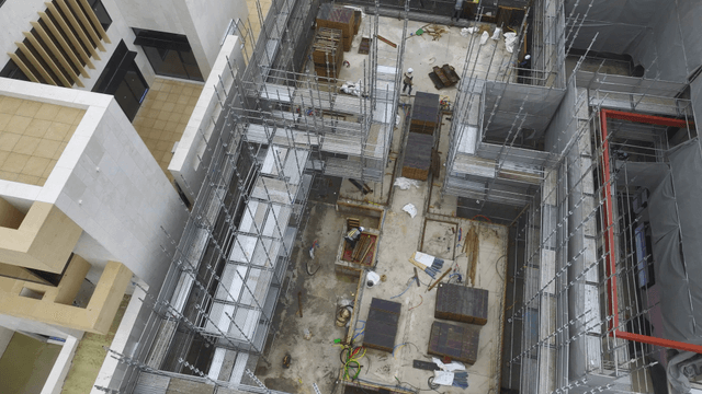 Construction site with scaffolding and workers