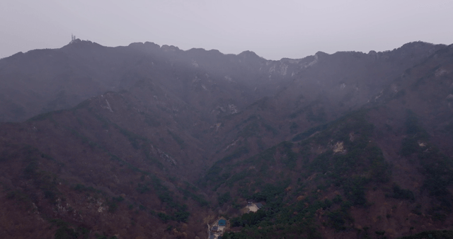 Misty mountain range with a valley