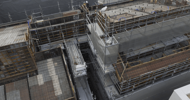Construction site with scaffolding and workers