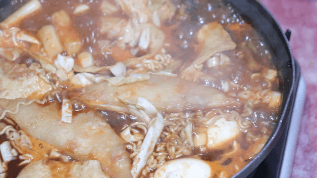 Spicy tteokbokki simmering in a pot