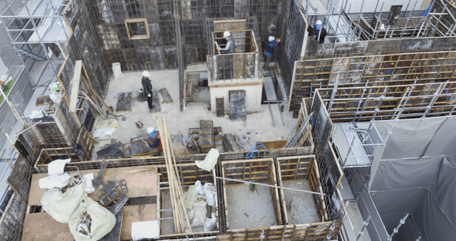 Construction site with workers and scaffolding