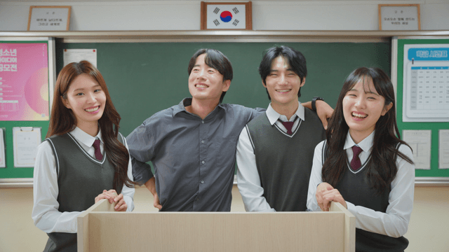 Students and teacher smiling in classroom
