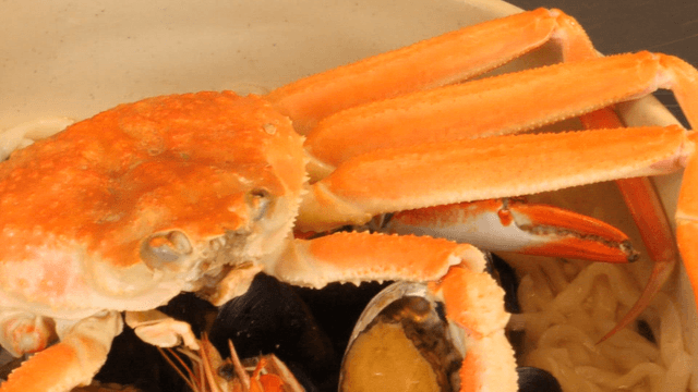 Crab and seafood in a noodle soup