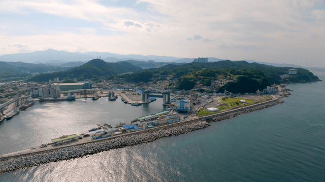 Coastal village with mountains and sea