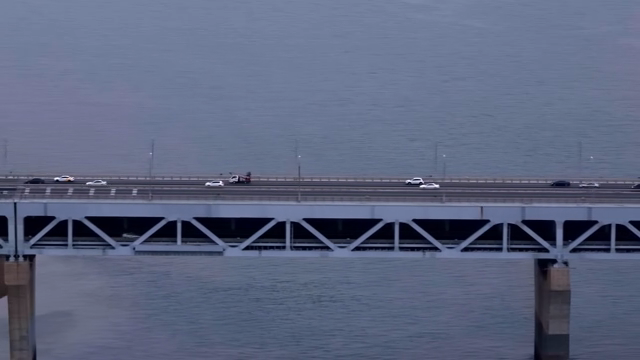 Cars driving on a bridge over the sea