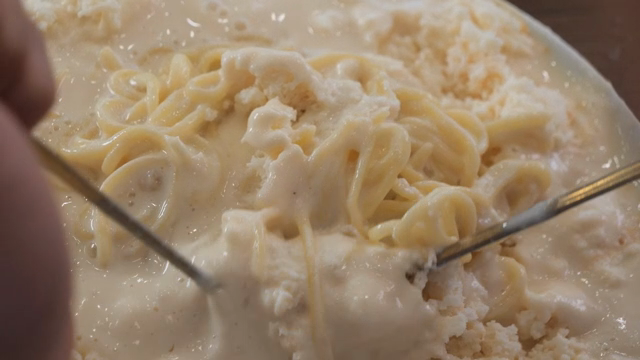 Cold soybean soup being mixed with chopsticks