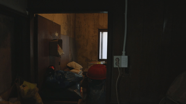 Cluttered room with various items