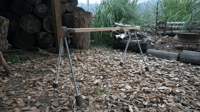 Handcrafted wooden bench in outdoor woodworking space
