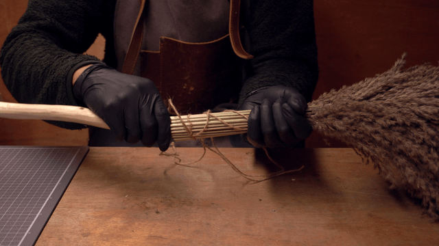 Crafting a traditional broom indoors