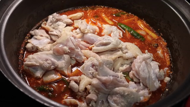 Chicken added to spicy sauce