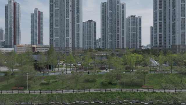 Cityscape with tall buildings and green park
