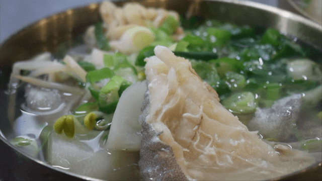 Clear cod soup with vegetables