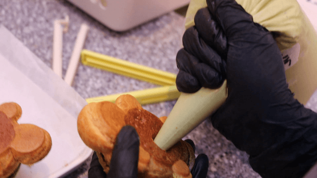 Filling turtle-shaped bread with cream