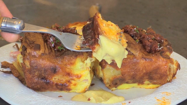 Croissant dipped in sauce