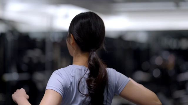 Young woman entering a gym