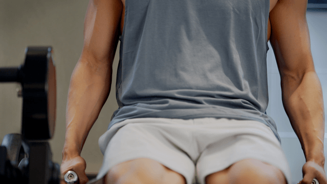 Man exercising on a machine in a gym