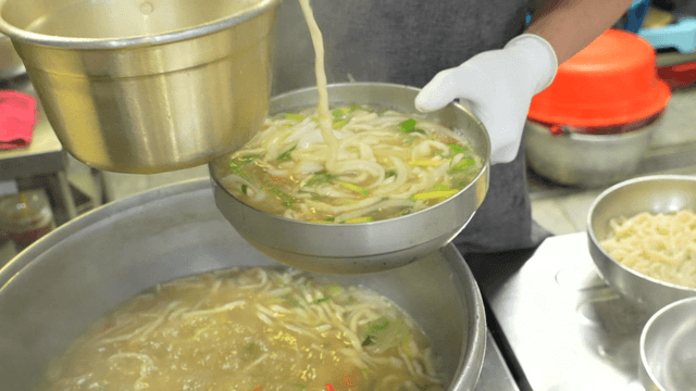 Hand-cut noodles served in a bowl in kitchen