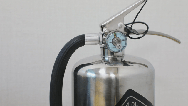 Close-up of a fire extinguisher indoors