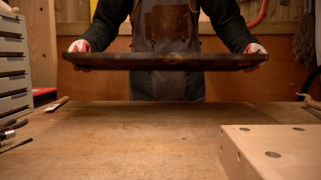 Burnt wooden board crafting in workshop