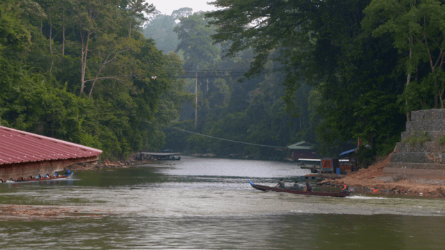 A boat with tourists on a serene river