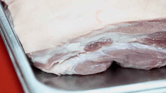 Raw pork on metal tray