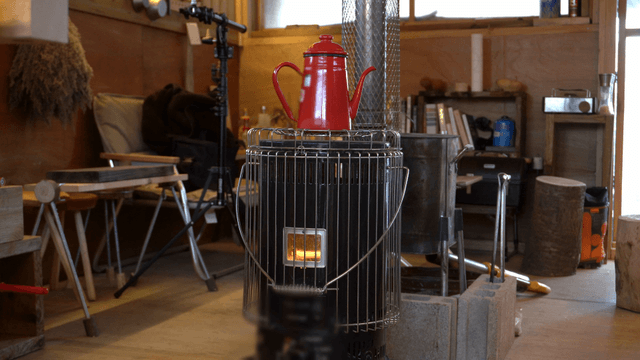 Heater with a red kettle on top