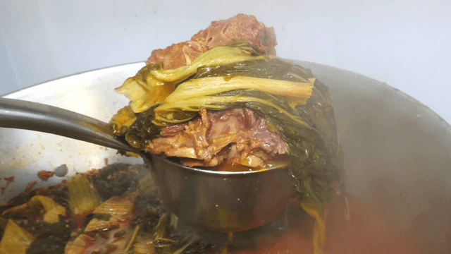 Ladle serving outer leaves pork back-bone stew