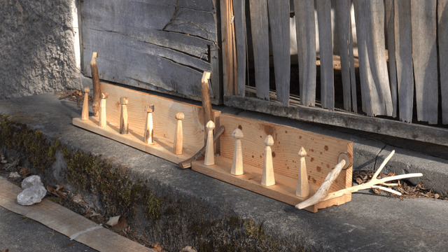 Wooden shelves displayed in front of a wooden wall