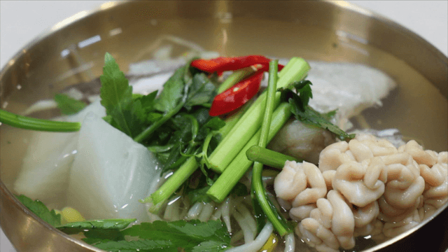 Cod soup with vegetables and fish milt