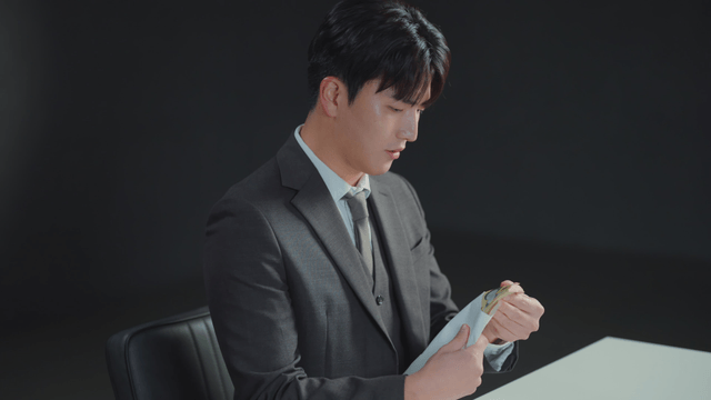 Man counting money inside an envelope
