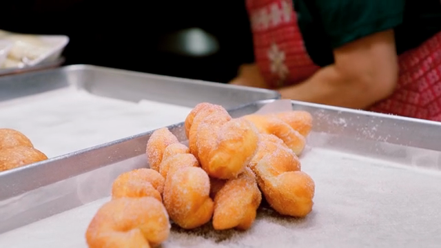 Freshly made sugar-covered donuts