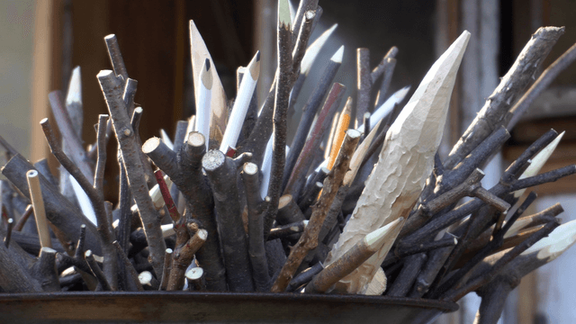 Fire pit filled with pointed wooden sticks