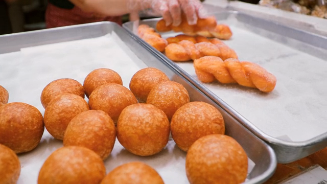 Freshly baked Korean donuts on trays