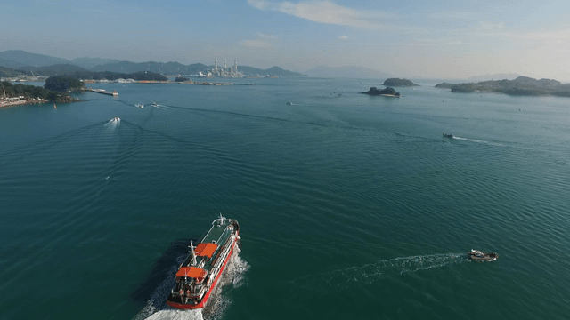 Passenger ships and fishing boats sailing on the open sea