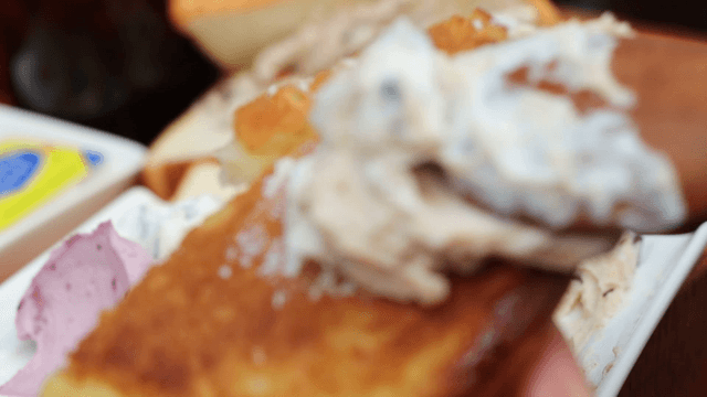 Yogurt spread on bread with a spoon