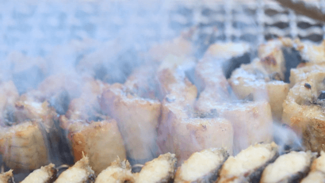 Sizzling charcoal-grilled eels