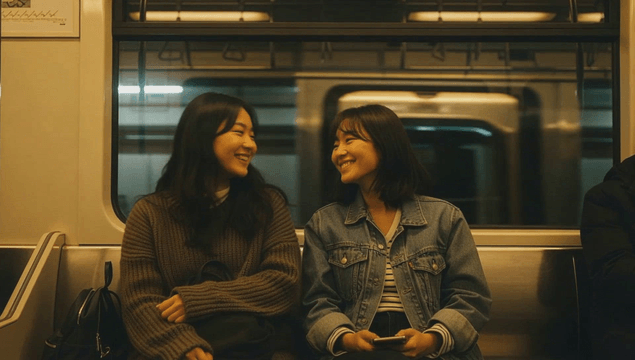Two women talking in a subway