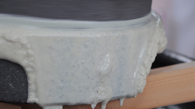 Traditional basalt millstone grinding grains