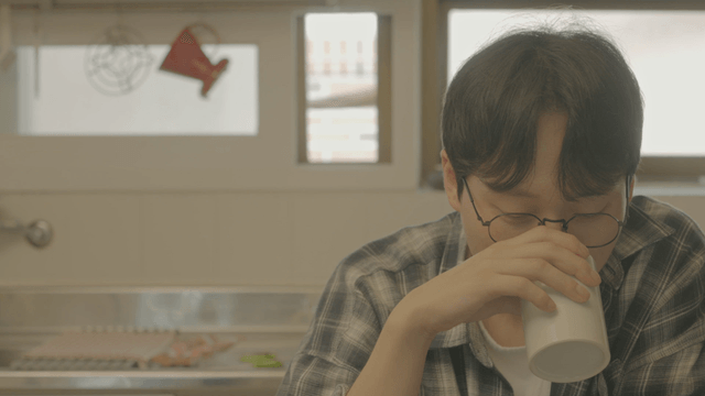 Man enjoying a tea in a cozy kitchen