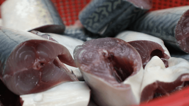 Freshly cut mackerel pieces in a basket