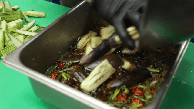 Cold cucumber and eggplant soup served on a tray