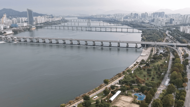 Aerial view of a city with bridges and river