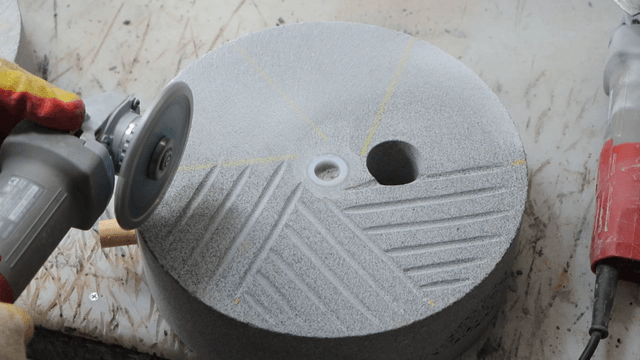 Grinder engraving patterns on basalt surface