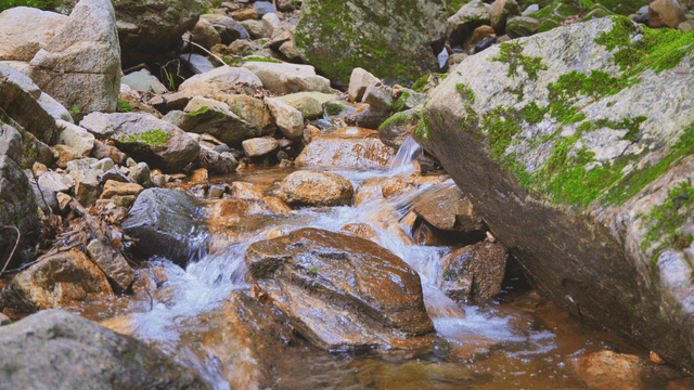 A small valley flowing over rocks