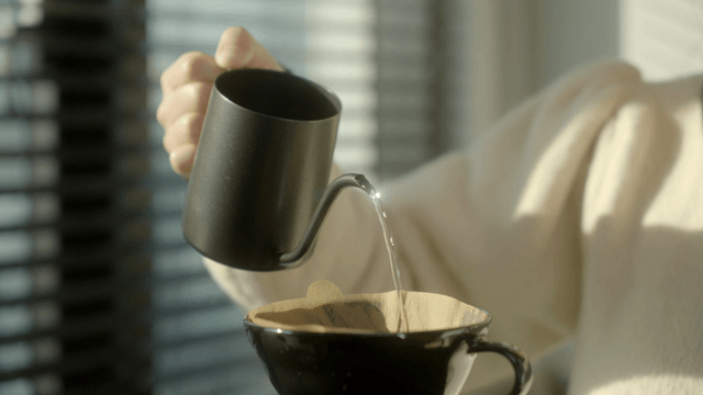 Pouring hot water into a coffee dripper