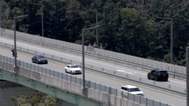 Cars driving on a highway bridge
