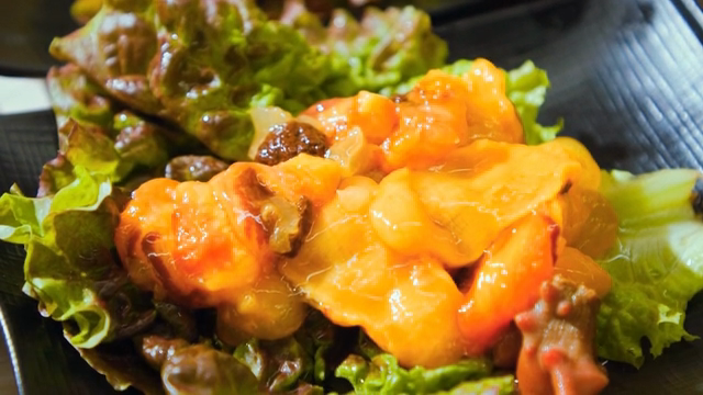 Fresh sea pineapple served on a bed of lettuce