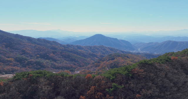 Vast mountain range with autumn foliage