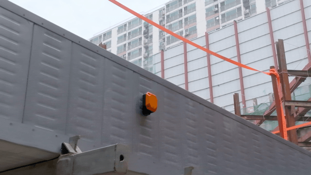 Construction site with building in background