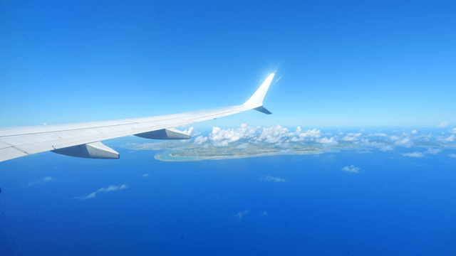 View of the ocean and land from an airplane
